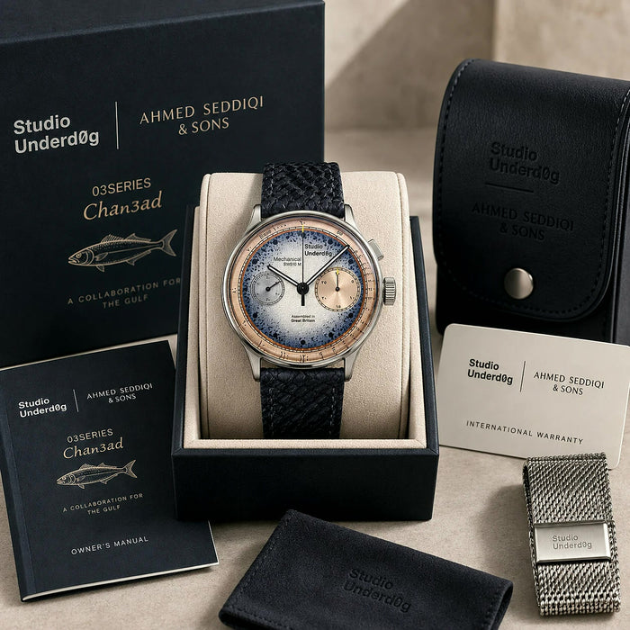 Studio Underd0g × Ahmed Seddiqi & Sons 03SERIES Chan3ad chronograph in its presentation box, with owner’s manual, travel case, warranty card, cloth and Milanese mesh bracelet.